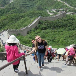 Young woman climbs the Great Wall in China